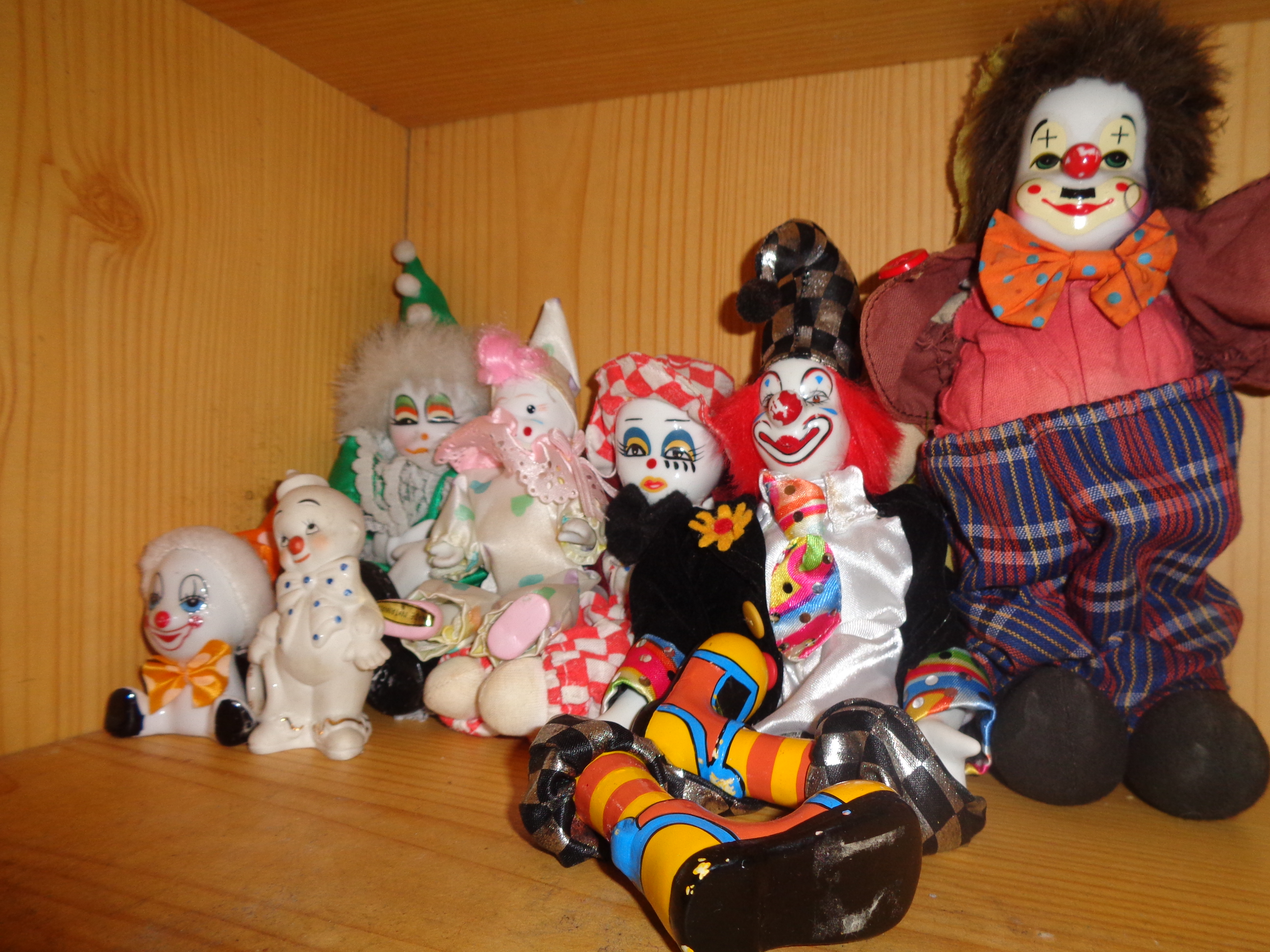 A photo of assorted porcelain clowns.